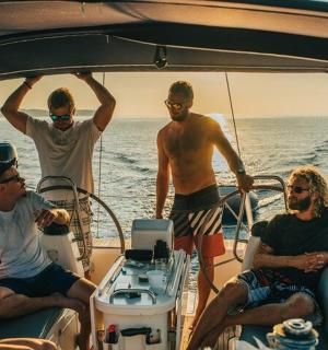 a group of people on a boat in the water