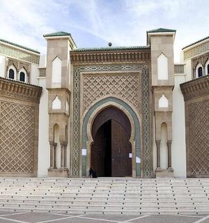 a large building with a large door and a courtyard