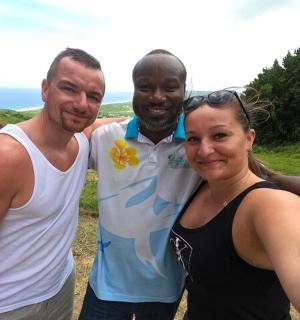 two men and a woman posing for a picture