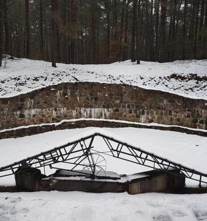 a bed in the snow in a snow covered field