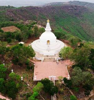 an overhead view of a large white building with a pagoda