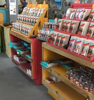 a store aisle with shelves filled with lots of products