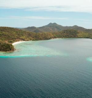 an aerial view of an island in the ocean