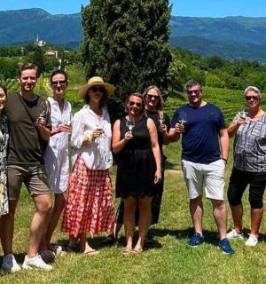 a group of people posing for a picture in a field