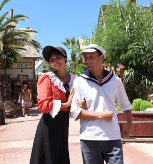 a man and a woman standing on a street