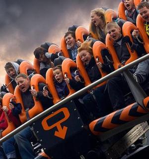 a group of children riding on an roller coaster