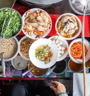 a table full of dishes of food on a table