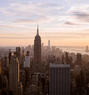 a view of a large city with a tall building