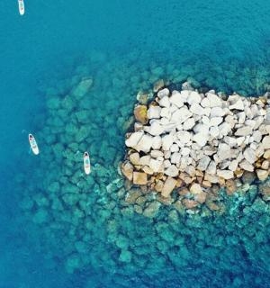 an aerial view of a small island in the water