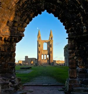 a view of a castle through an archway