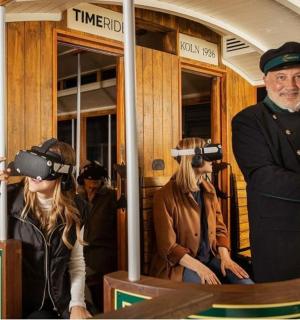a group of people wearing virtual reality headsets on a train