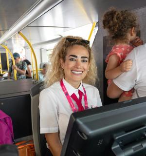 a woman is sitting on a bus