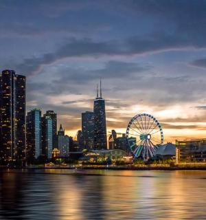 a city skyline with a ferris wheel and a city
