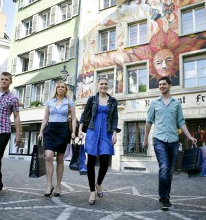 a group of people walking down a street