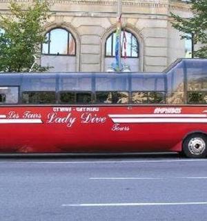 a red bus parked on the side of a street