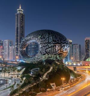 a large sculpture in the middle of a city at night