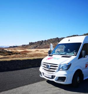 a white van is parked on a road