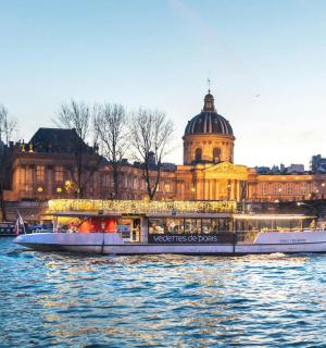 a boat on the river in front of a building