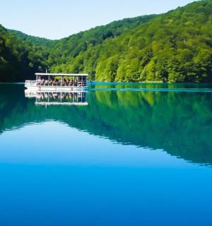 a boat on a lake with people on it