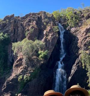 a waterfall on the side of a mountain