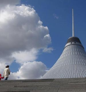 a man and a child standing on top of a building