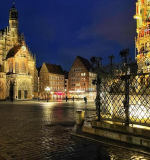 a large building with a clock tower at night