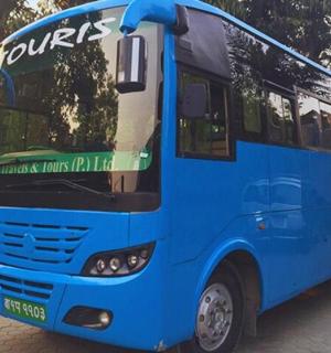 a blue bus is parked on a street
