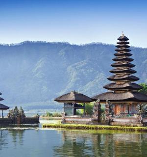 a group of temples in the middle of a body of water