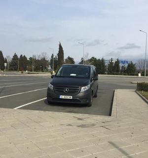 a black car parked in a parking lot