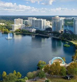 an aerial view of a large lake in a city