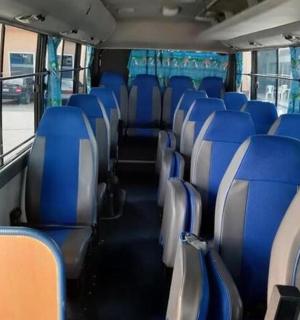 a bus with blue seats on a bus