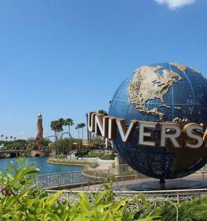 a large globe in the middle of a park