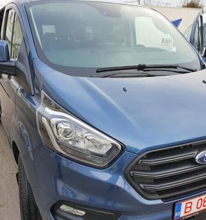 a blue van parked in a parking lot