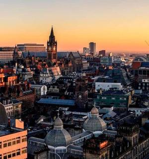 an aerial view of a city at sunset