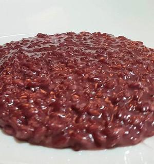 a pile of beans on a white plate