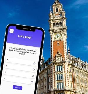 a cell phone in front of a building with a clock tower