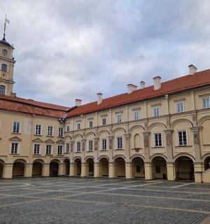a large building with a clock tower in the background