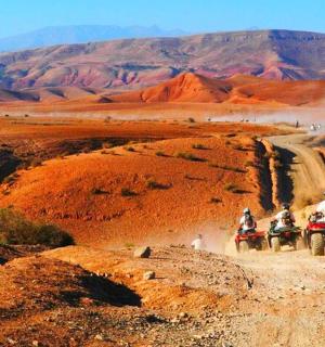 a group of people riding on motorcycles in the desert