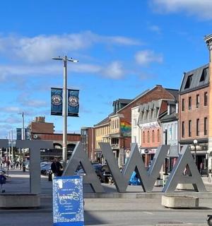 a large metal sign that says walk in a city
