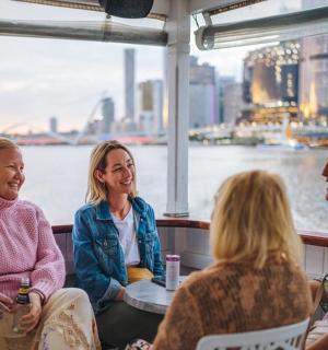 a group of people sitting on a boat