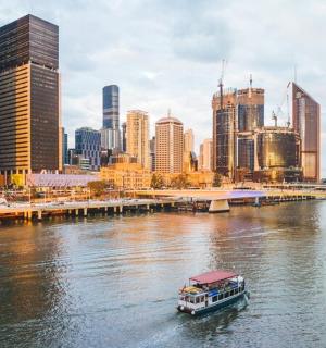 a boat on a river in a city