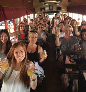 a group of people holding up their drinks