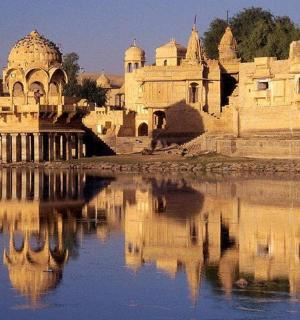 a building with its reflection in a body of water