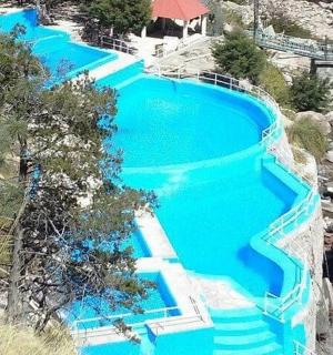 an overhead view of a pool with blue water