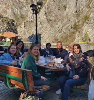 a group of people are sitting at a table