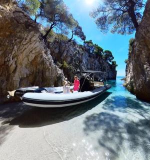 a boat in the water next to a beach