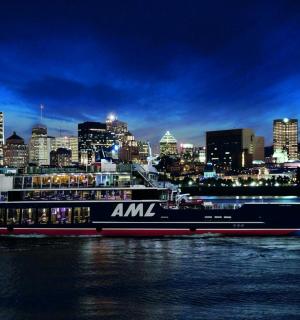 a boat in the water with a city in the background