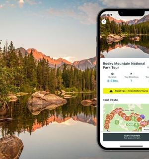 an iphone taking a picture of a lake