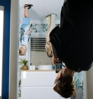 a person standing in a room with their legs up