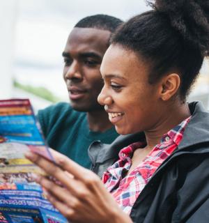 a young woman looking at a tablet computer
